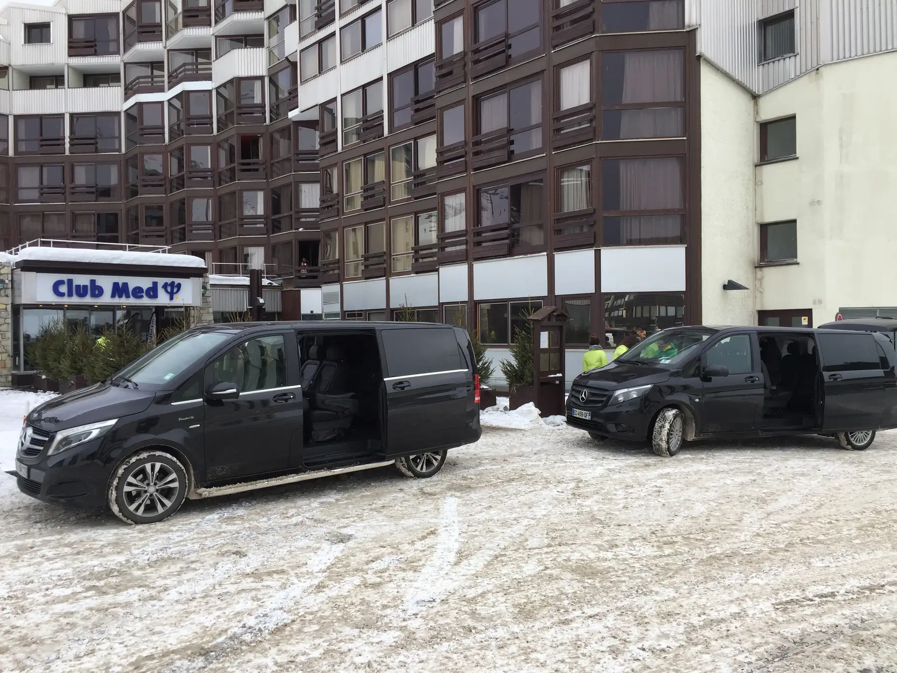 Private transfer service at Tignes: two Mercedes V Class with chauffeur waiting in the snow